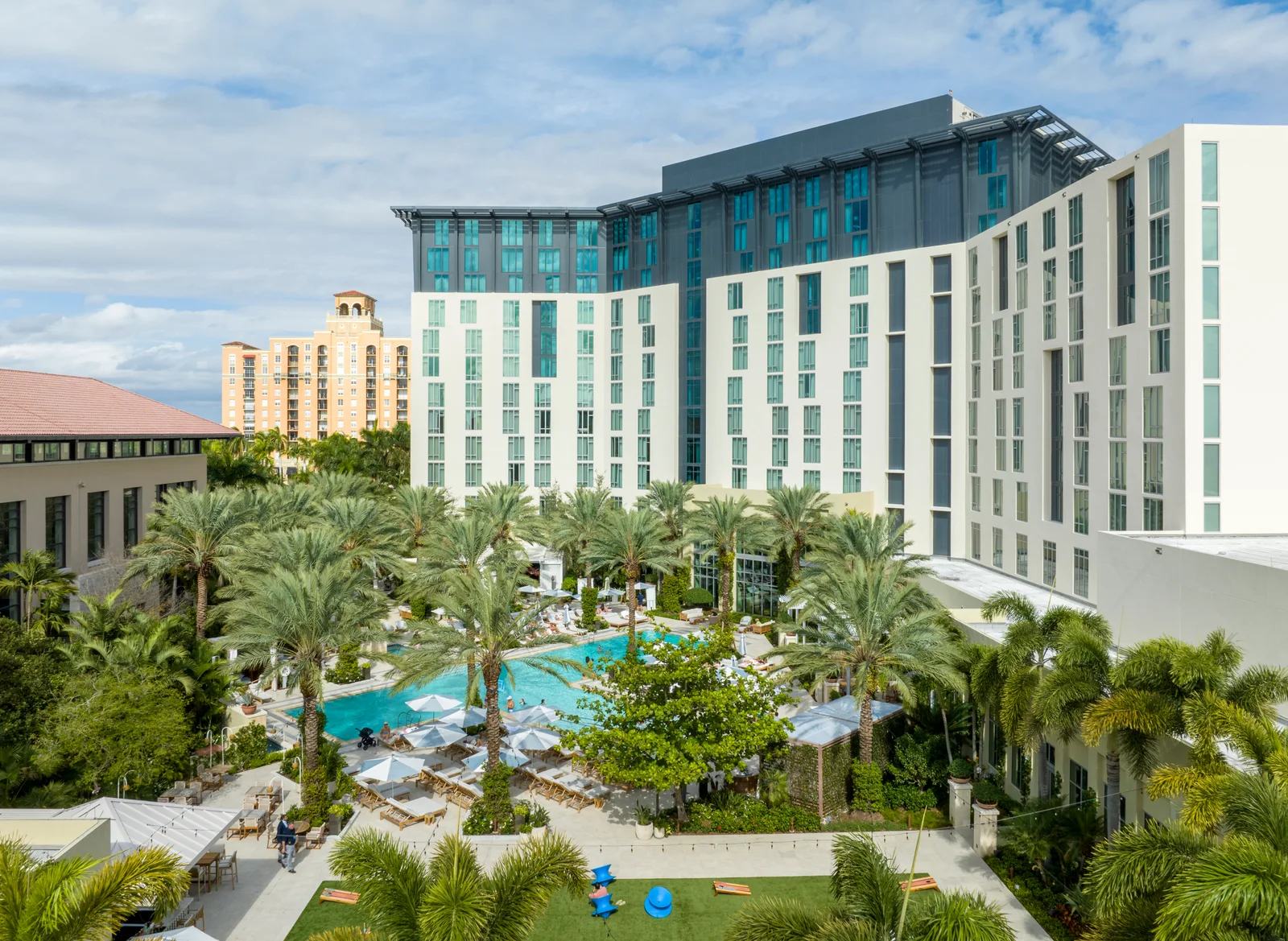 Hilton West Palm Beach hotel exterior and resort-style pool